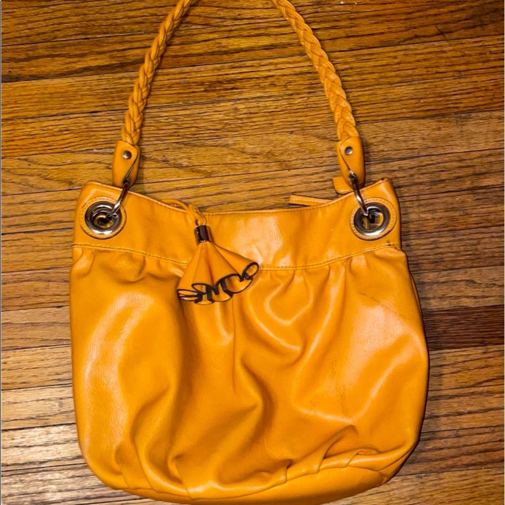 Brand is Kelly and Katie, it is one size fits all, and it is a mustard yellow.